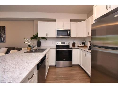 203-2605 Binbrook Road, Binbrook, ON - Indoor Photo Showing Kitchen With Stainless Steel Kitchen With Double Sink