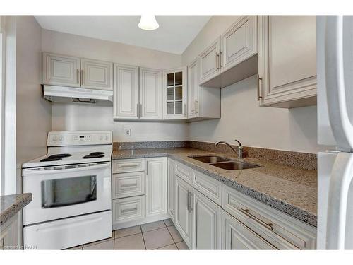 1505-2263 Marine Drive, Oakville, ON - Indoor Photo Showing Kitchen With Double Sink