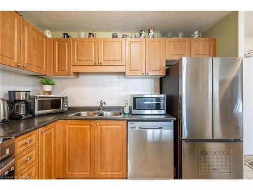 504-2900 Battleford Road, Mississauga, ON - Indoor Photo Showing Kitchen With Double Sink