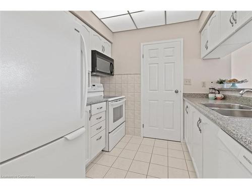 703-495 8 Highway, Stoney Creek, ON - Indoor Photo Showing Kitchen With Double Sink