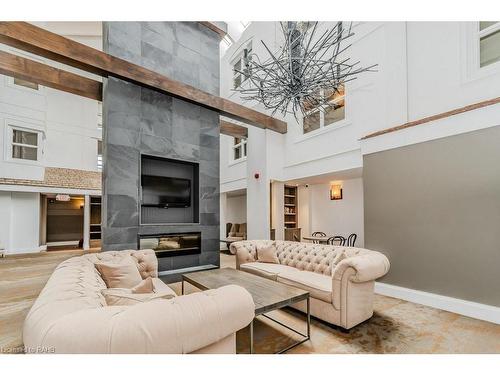 54-305-1235 Deerhurst Drive, Huntsville, ON - Indoor Photo Showing Living Room With Fireplace