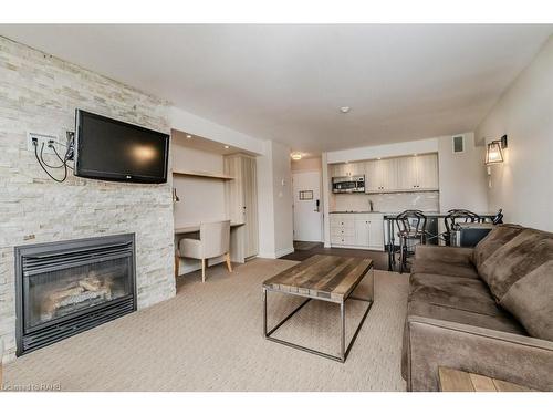 54-305-1235 Deerhurst Drive, Huntsville, ON - Indoor Photo Showing Living Room With Fireplace