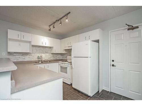 309-4003 Kilmer Drive, Burlington, ON - Indoor Photo Showing Kitchen With Double Sink