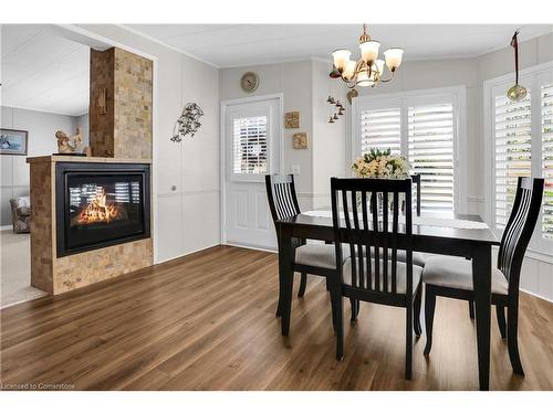 223-3033 Townline Road, Stevensville, ON - Indoor Photo Showing Dining Room With Fireplace