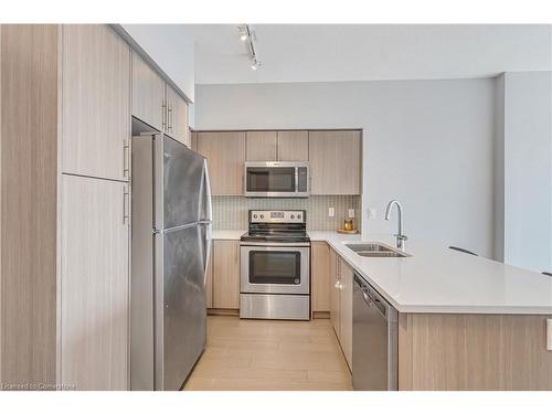 1106-55 Speers Road, Oakville, ON - Indoor Photo Showing Kitchen With Double Sink