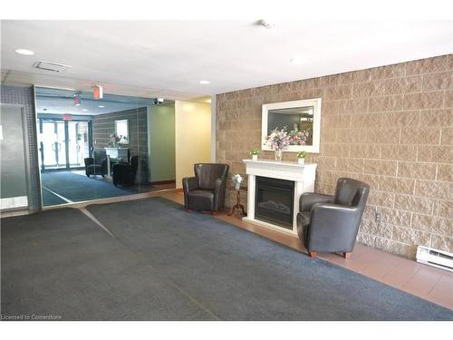 301-175 Hunter Street E, Hamilton, ON - Indoor With Fireplace