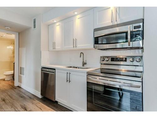 54-304-1235 Deerhurst Drive, Huntsville, ON - Indoor Photo Showing Kitchen With Double Sink With Upgraded Kitchen