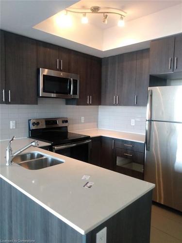 807-560 North Service Road, Grimsby, ON - Indoor Photo Showing Kitchen With Double Sink