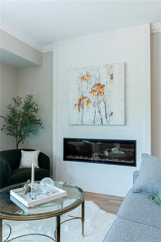 208-5188 Lakeshore Road, Burlington, ON - Indoor Photo Showing Living Room With Fireplace