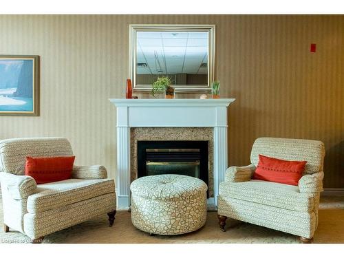 208-5188 Lakeshore Road, Burlington, ON - Indoor Photo Showing Living Room With Fireplace