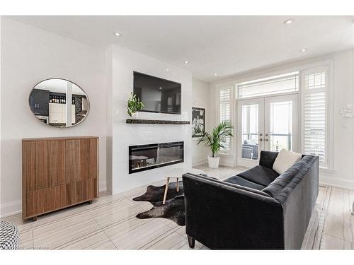 1083 Beach Boulevard, Hamilton, ON - Indoor Photo Showing Living Room With Fireplace