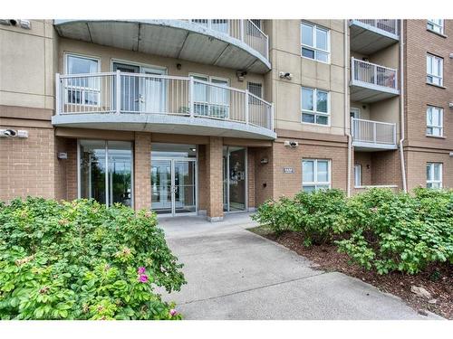 307-4450 Fairview Street, Burlington, ON - Outdoor With Balcony With Facade