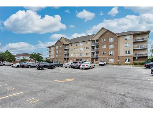 307-4450 Fairview Street, Burlington, ON - Outdoor With Balcony With Facade