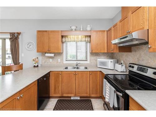 70-34 Southbrook Drive, Binbrook, ON - Indoor Photo Showing Kitchen With Double Sink