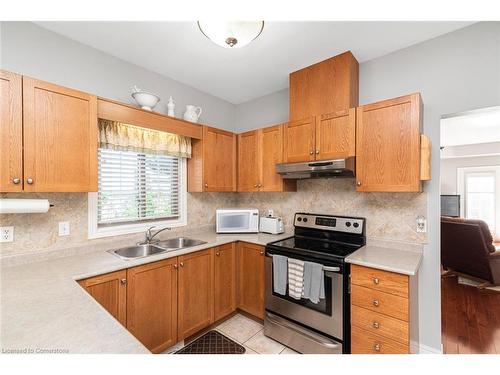 70-34 Southbrook Drive, Binbrook, ON - Indoor Photo Showing Kitchen With Double Sink