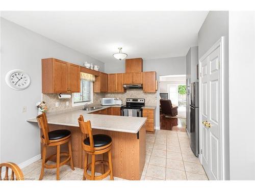 70-34 Southbrook Drive, Binbrook, ON - Indoor Photo Showing Kitchen With Double Sink