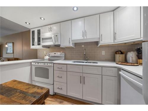 204-1270 Maple Crossing Boulevard, Burlington, ON - Indoor Photo Showing Kitchen With Double Sink