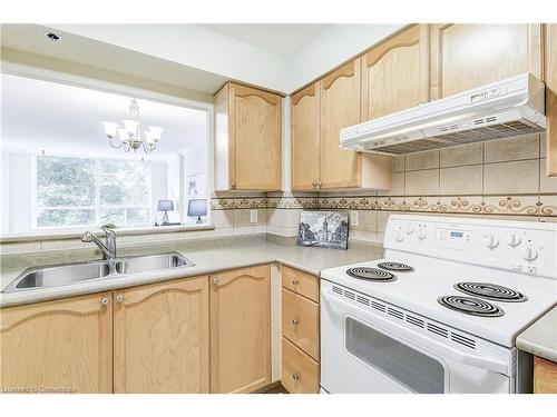 1308-100 Burloak Drive, Burlington, ON - Indoor Photo Showing Kitchen With Double Sink