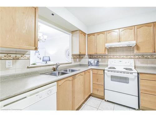 1308-100 Burloak Drive, Burlington, ON - Indoor Photo Showing Kitchen With Double Sink