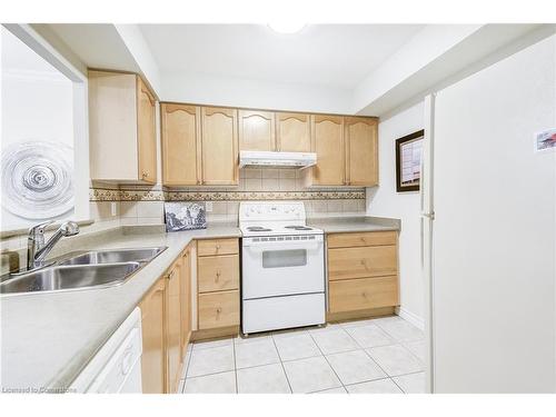 1308-100 Burloak Drive, Burlington, ON - Indoor Photo Showing Kitchen With Double Sink