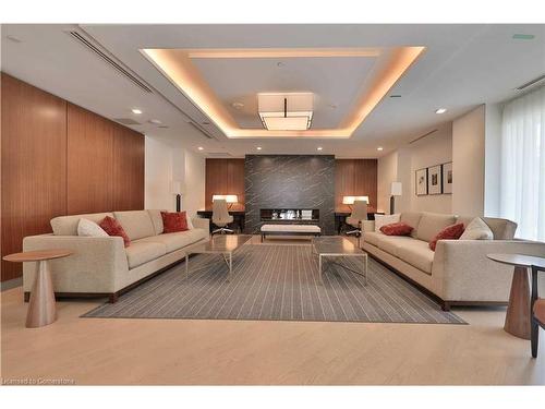 234-1575 Lakeshore Road W, Mississauga, ON - Indoor Photo Showing Living Room With Fireplace