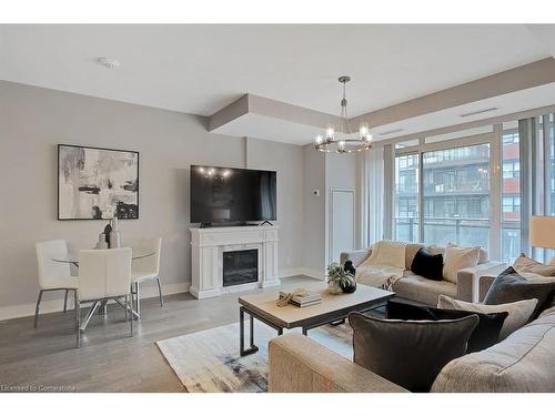 234-1575 Lakeshore Road W, Mississauga, ON - Indoor Photo Showing Living Room With Fireplace