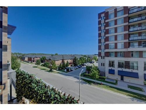 304-1940 Ironstone Drive, Burlington, ON - Outdoor With Balcony With Facade