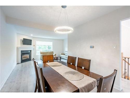 11-384 Limeridge Road E, Hamilton, ON - Indoor Photo Showing Dining Room With Fireplace