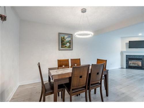 11-384 Limeridge Road E, Hamilton, ON - Indoor Photo Showing Dining Room With Fireplace