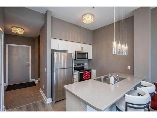 610-16 Concord Place, Grimsby, ON - Indoor Photo Showing Kitchen With Double Sink