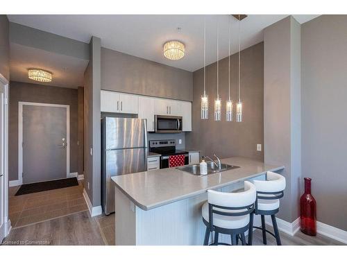 610-16 Concord Place, Grimsby, ON - Indoor Photo Showing Kitchen With Double Sink