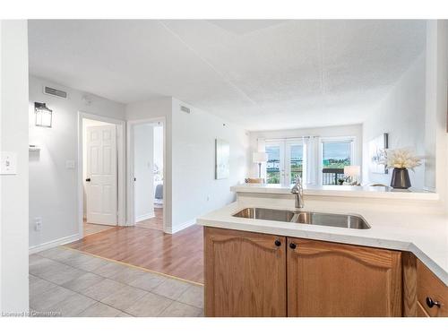 307-4450 Fairview Street, Burlington, ON - Indoor Photo Showing Kitchen With Double Sink