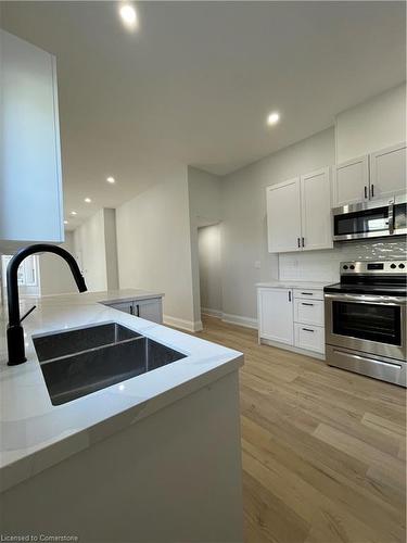 1-50 Erie Avenue, Hamilton, ON - Indoor Photo Showing Kitchen With Double Sink