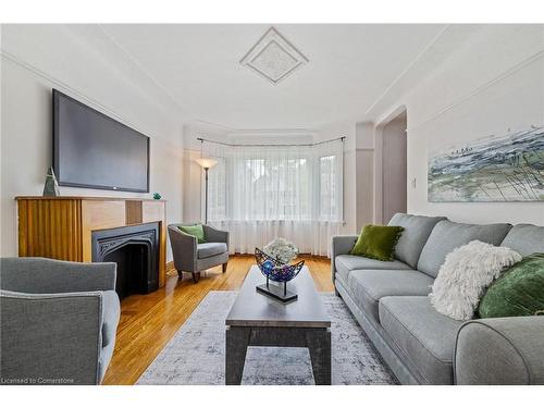 24 Thorndale Street N, Hamilton, ON - Indoor Photo Showing Living Room With Fireplace