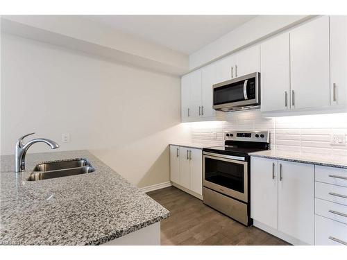 320-150 Oak Park Boulevard, Oakville, ON - Indoor Photo Showing Kitchen With Stainless Steel Kitchen With Double Sink