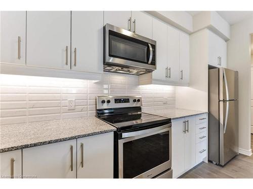 320-150 Oak Park Boulevard, Oakville, ON - Indoor Photo Showing Kitchen With Stainless Steel Kitchen With Upgraded Kitchen