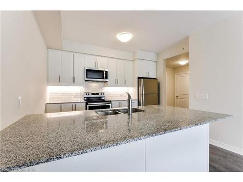 320-150 Oak Park Boulevard, Oakville, ON - Indoor Photo Showing Kitchen With Stainless Steel Kitchen With Double Sink With Upgraded Kitchen