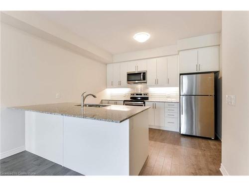 320-150 Oak Park Boulevard, Oakville, ON - Indoor Photo Showing Kitchen With Stainless Steel Kitchen With Upgraded Kitchen