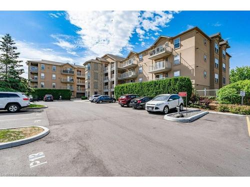 101-1450 Bishops Gate, Oakville, ON - Outdoor With Balcony With Facade