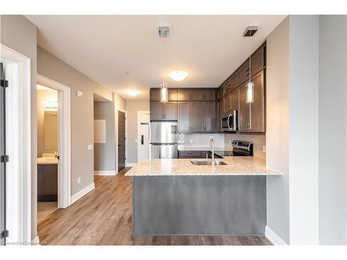 303-50 Kaitting Trail, Oakville, ON - Indoor Photo Showing Kitchen With Double Sink