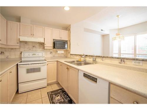 102-5188 Lakeshore Road, Burlington, ON - Indoor Photo Showing Kitchen With Double Sink