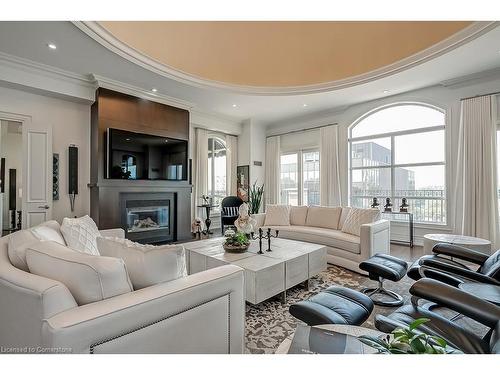 Ph1-445 Elizabeth Street, Burlington, ON - Indoor Photo Showing Living Room With Fireplace