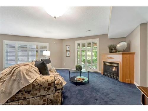 23-2120 Headon Road, Burlington, ON - Indoor Photo Showing Living Room With Fireplace