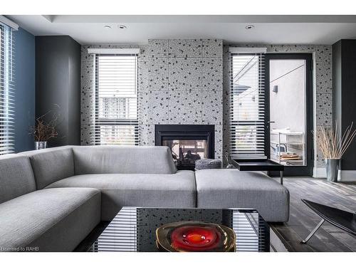 Ph6-181 James Street N, Hamilton, ON - Indoor Photo Showing Living Room With Fireplace