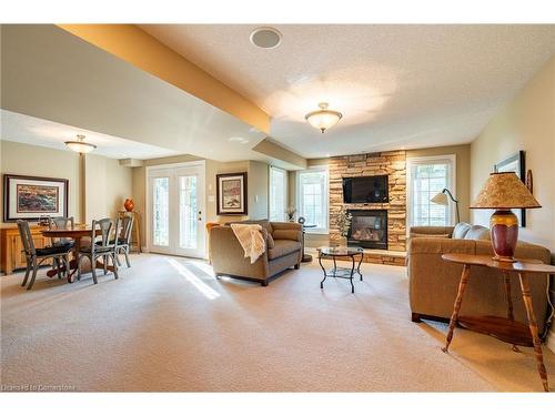 24-875 University Avenue E, Waterloo, ON - Indoor Photo Showing Living Room With Fireplace