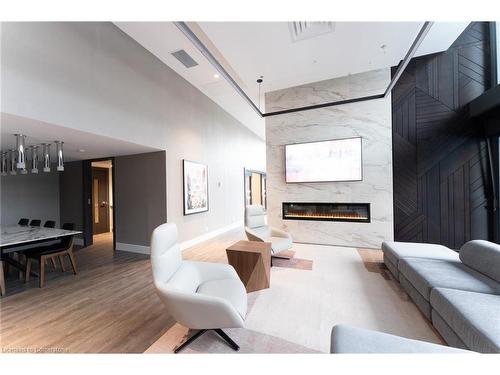 604-8 Hughson Street N, Hamilton, ON - Indoor Photo Showing Living Room With Fireplace