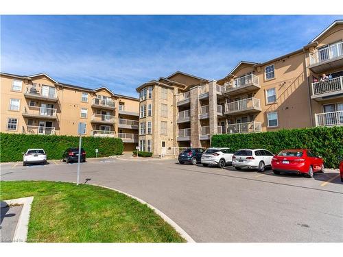 213-1480 Bishops Gate, Oakville, ON - Outdoor With Balcony With Facade