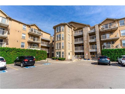 213-1480 Bishops Gate, Oakville, ON - Outdoor With Balcony With Facade