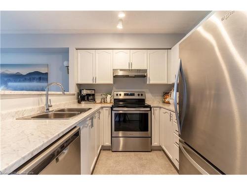 213-1480 Bishops Gate, Oakville, ON - Indoor Photo Showing Kitchen With Stainless Steel Kitchen With Double Sink