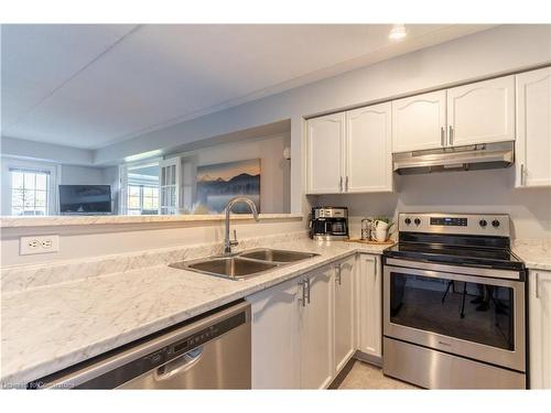 213-1480 Bishops Gate, Oakville, ON - Indoor Photo Showing Kitchen With Stainless Steel Kitchen With Double Sink